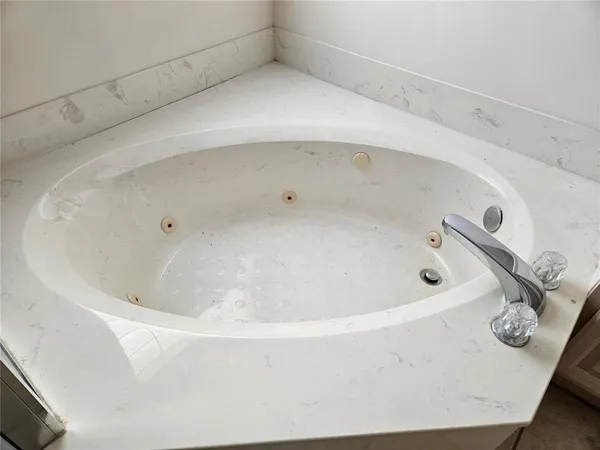 a bathroom with a sink and mirror with toilet