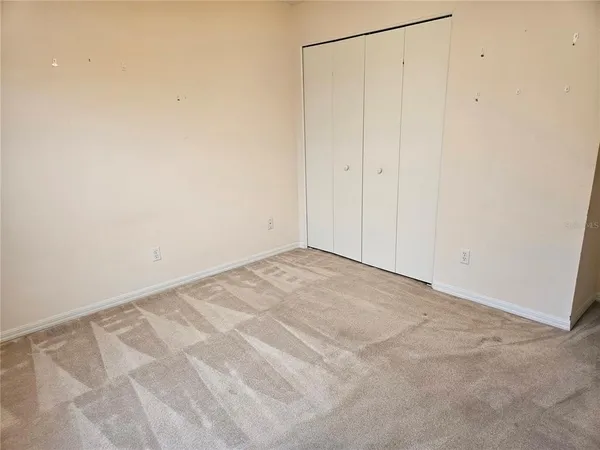 a utility room with cabinets washer and dryer