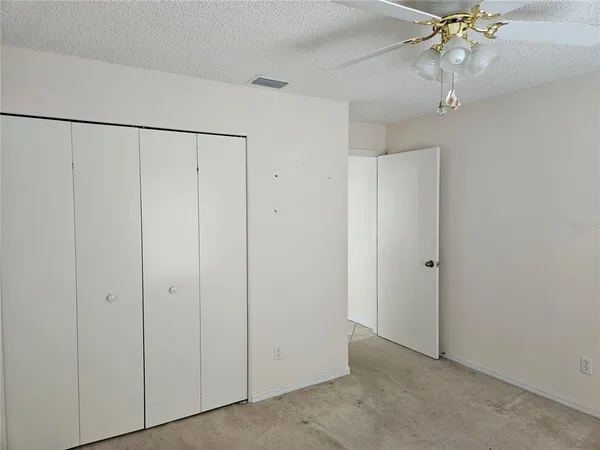 a view of a hallway with wooden floors
