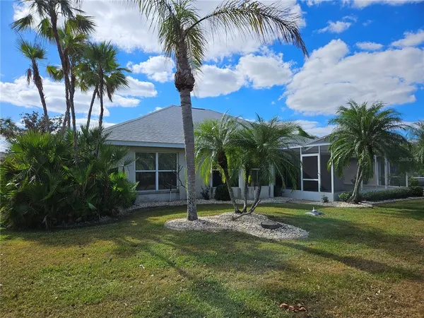 a view of a palm trees in front of a house