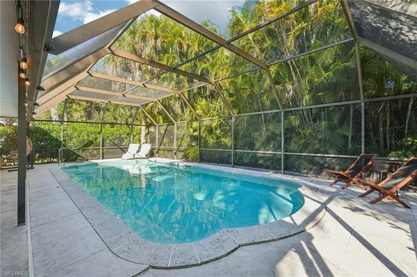 a view of a swimming pool with a patio