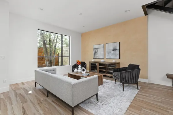 a living room with furniture and a large window