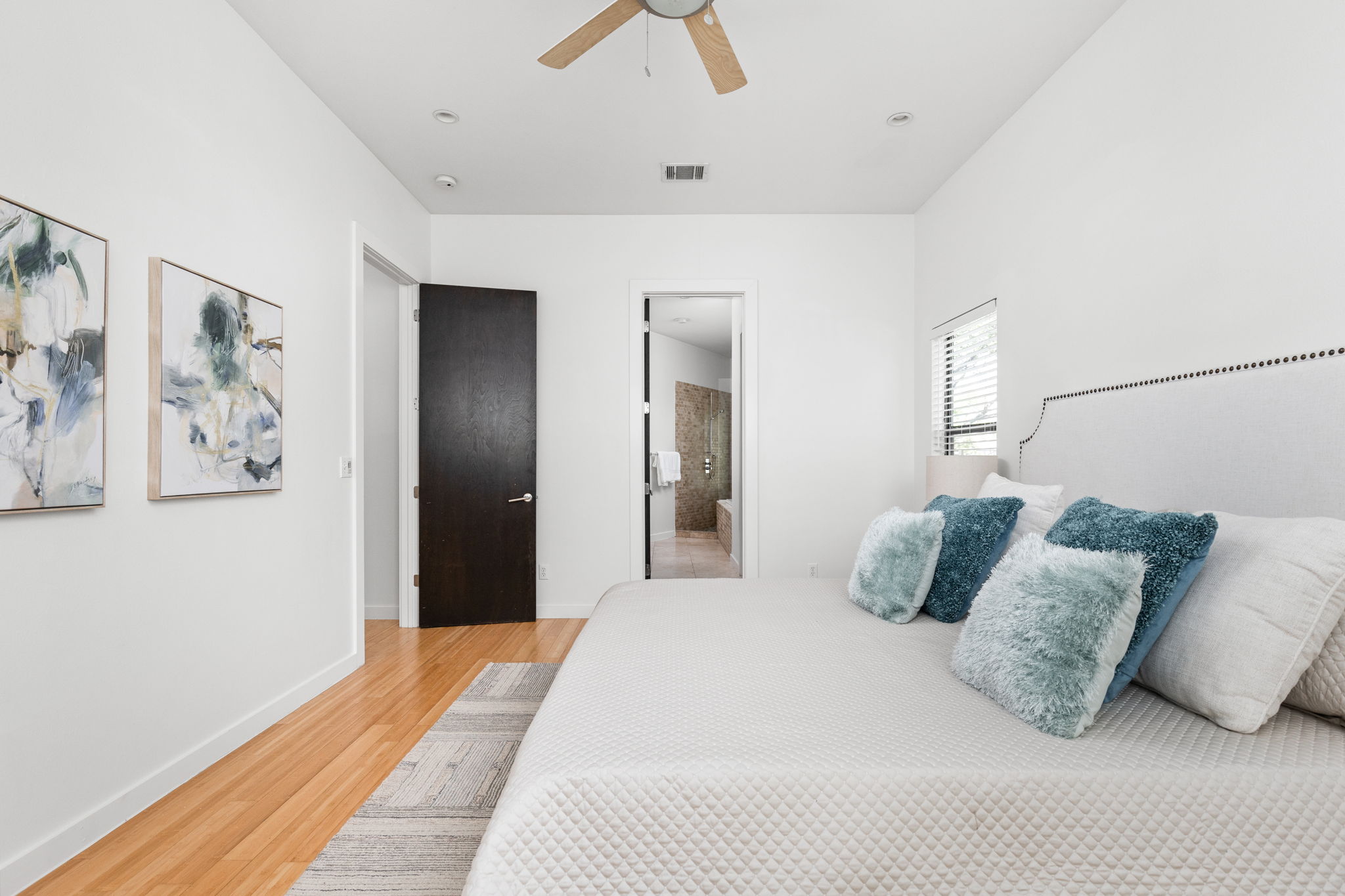 1907 West 30th Street Austin, TX 78703 - Photo 24 of 35 a bedroom with a bed and ceiling fan