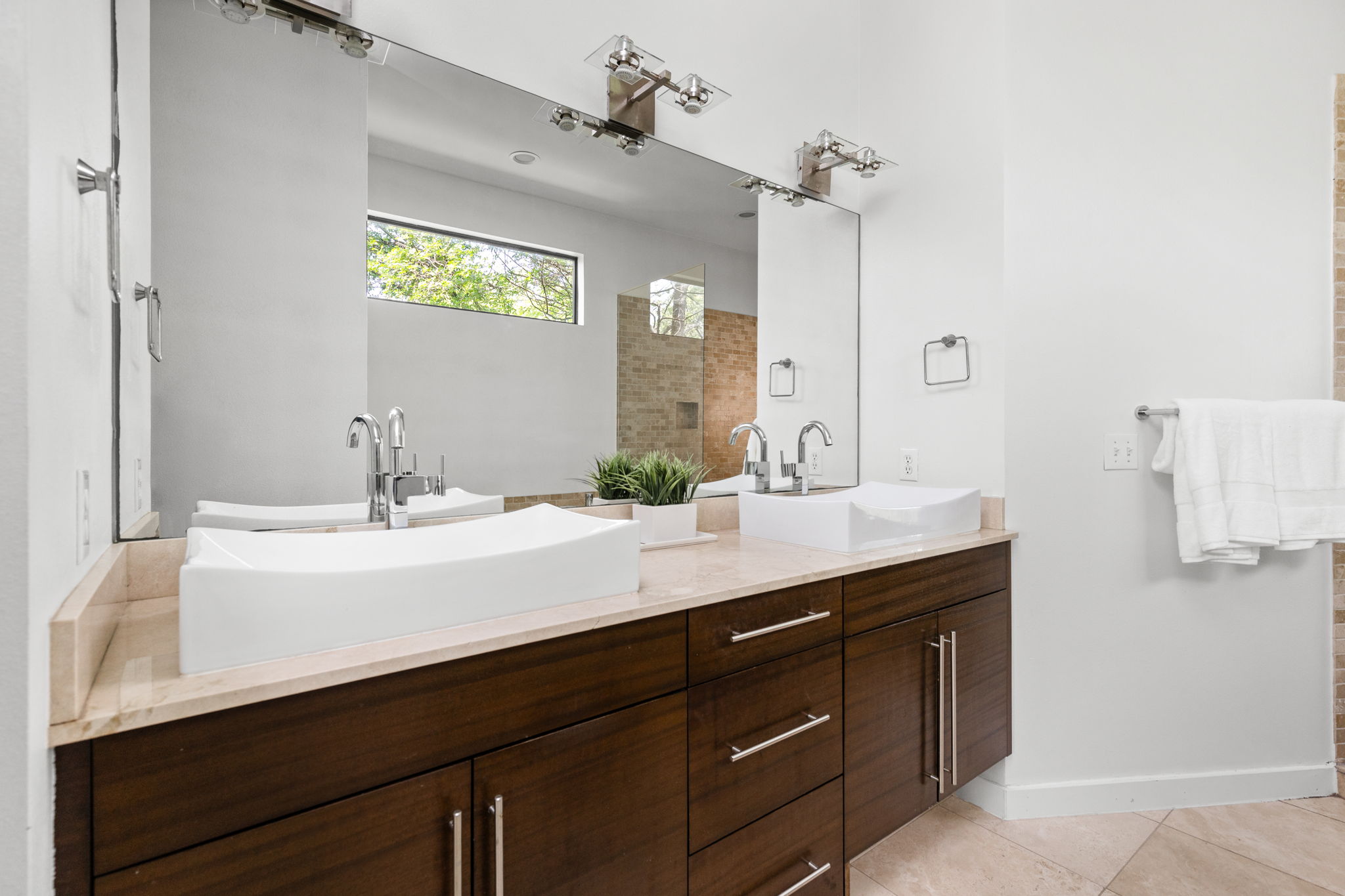 1907 West 30th Street Austin, TX 78703 - Photo 26 of 35 a bathroom with a sink double vanity granite and a mirror