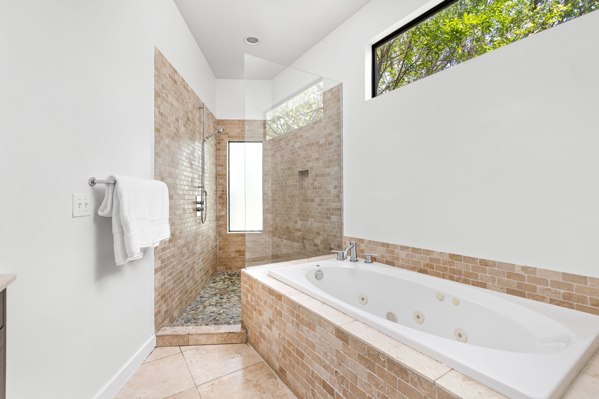 1907 West 30th Street Austin, TX 78703 - Photo 27 of 35 a bathroom with a bathtub and shower
