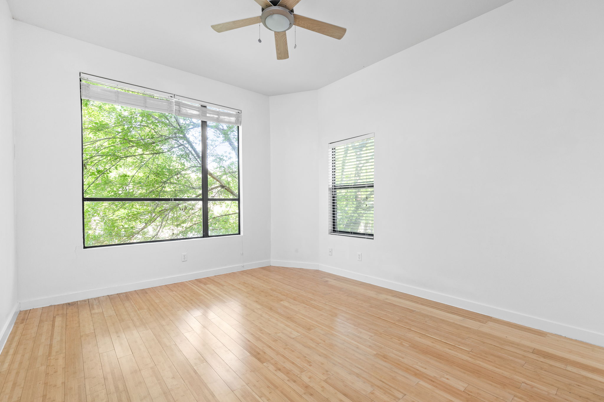 1907 West 30th Street Austin, TX 78703 - Photo 29 of 35 a view of an empty room with wooden floor and a window