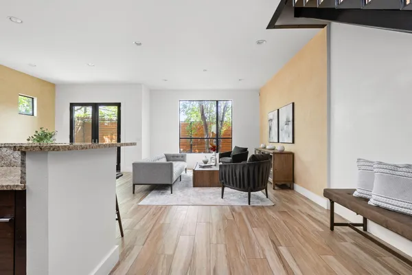 a living room with furniture and a large window
