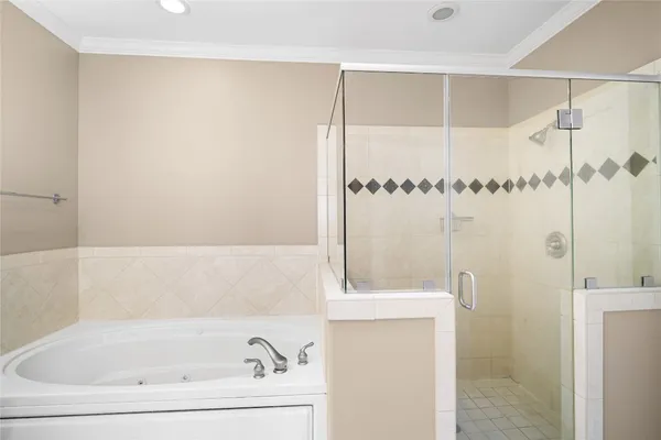 a bathroom with a bathtub and a shower