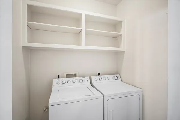 a view of a hallway with a white walls