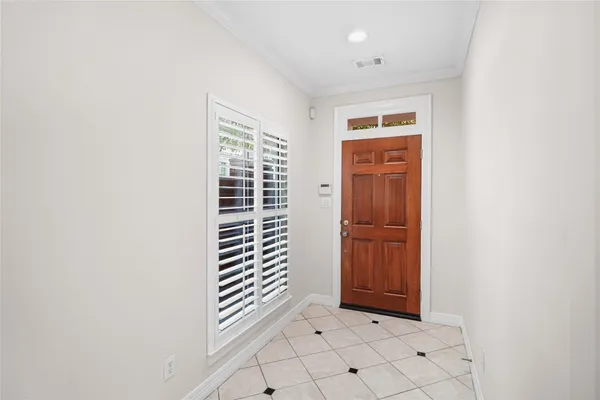 a view of entryway with wooden floor