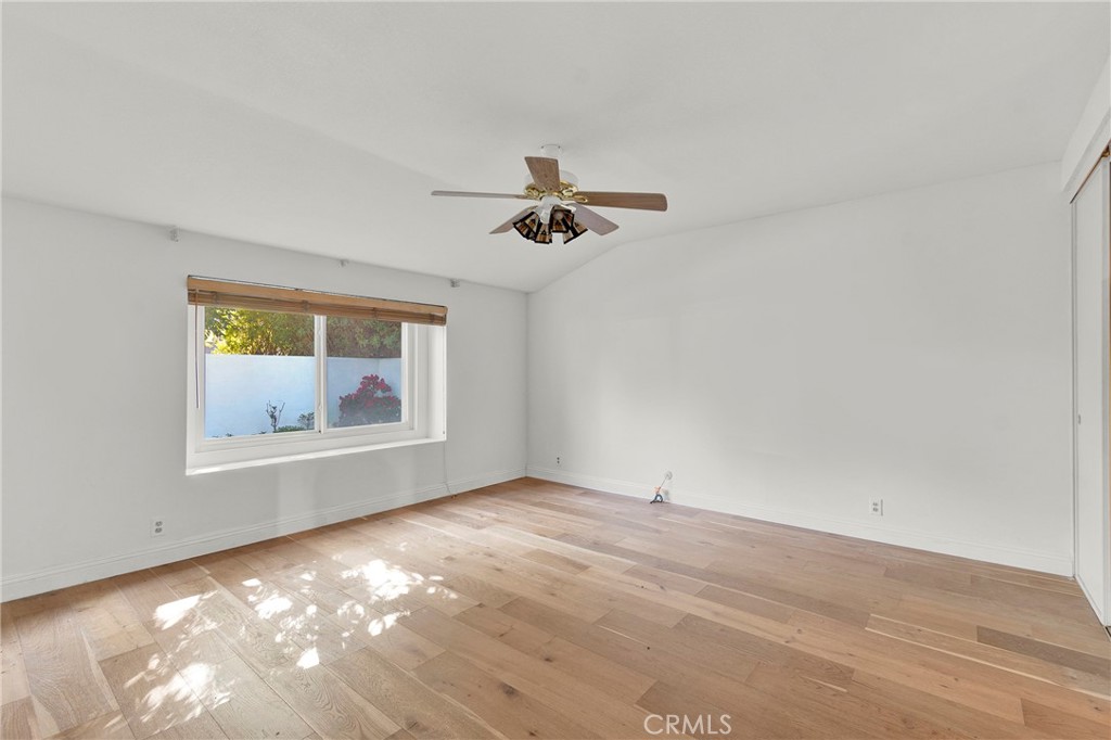 13381 Epping Way Tustin, CA 92780 - Photo 16 of 52 an empty room with a window and a ceiling fan
