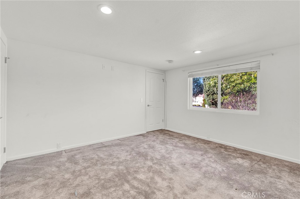 13381 Epping Way Tustin, CA 92780 - Photo 35 of 52 an empty room with windows