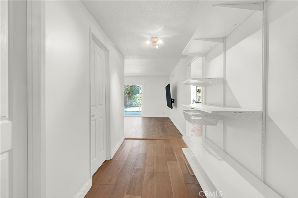 13381 Epping Way Tustin, CA 92780 - Photo 6 of 52 a view of a hallway with wooden floor