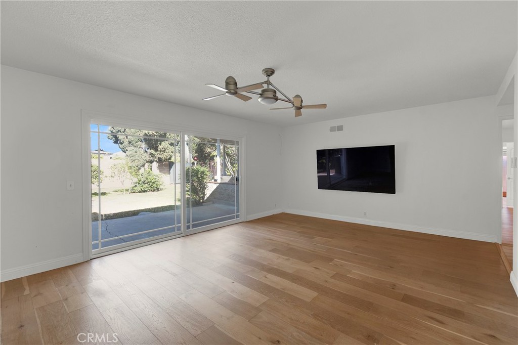 13381 Epping Way Tustin, CA 92780 - Photo 9 of 52 wooden floor in an empty room with a window