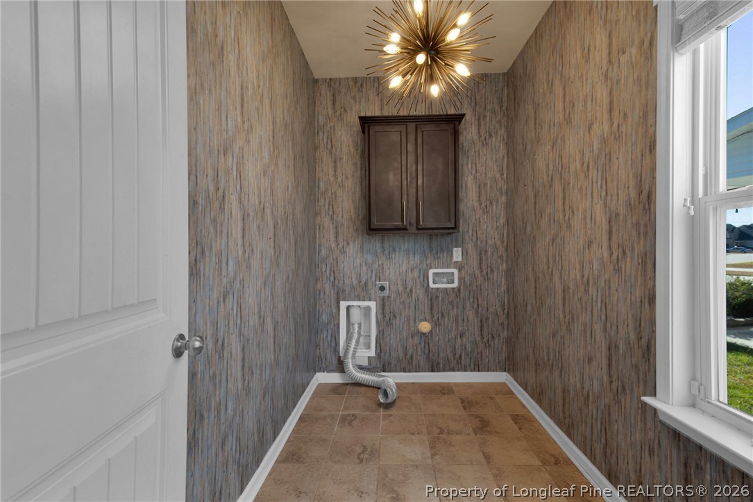 2145 Harrington Road Fayetteville, NC 28306 - Photo 26 of 50 a view of an empty room with chandelier fan and a window