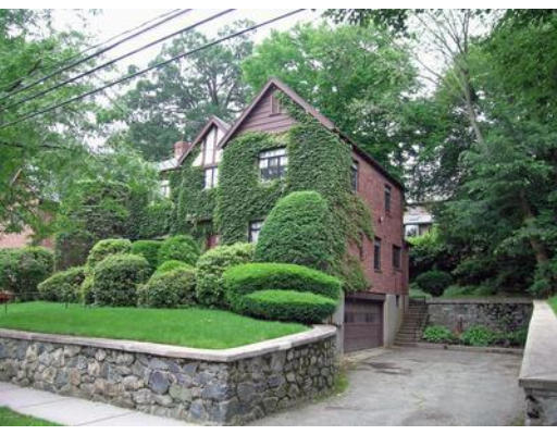 73 Welland Road Brookline, MA 02445 - Photo 2 of 12 a front view of a house with a yard and potted plants