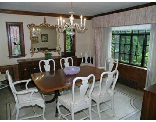 73 Welland Road Brookline, MA 02445 - Photo 3 of 12 a view of a dining room with furniture a chandelier and wooden floor