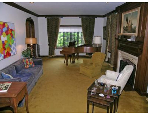 73 Welland Road Brookline, MA 02445 - Photo 6 of 12 a living room with furniture and a fireplace