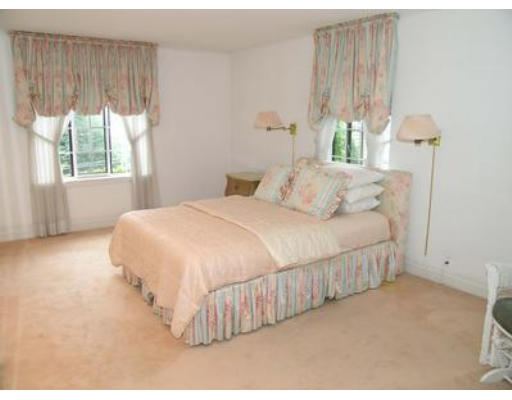73 Welland Road Brookline, MA 02445 - Photo 9 of 12 a bedroom with a bed and a large window