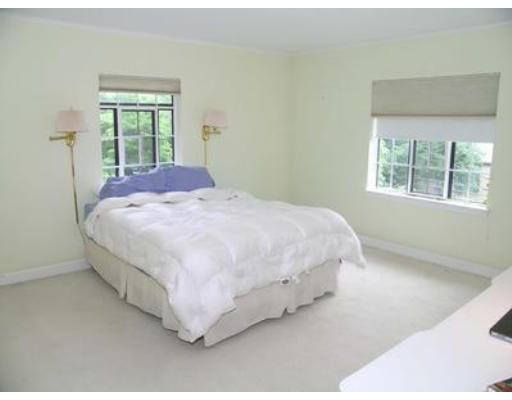 73 Welland Road Brookline, MA 02445 - Photo 10 of 12 a bed sitting in a bedroom next to a window