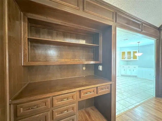 a kitchen with stainless steel appliances granite countertop a sink and cabinets