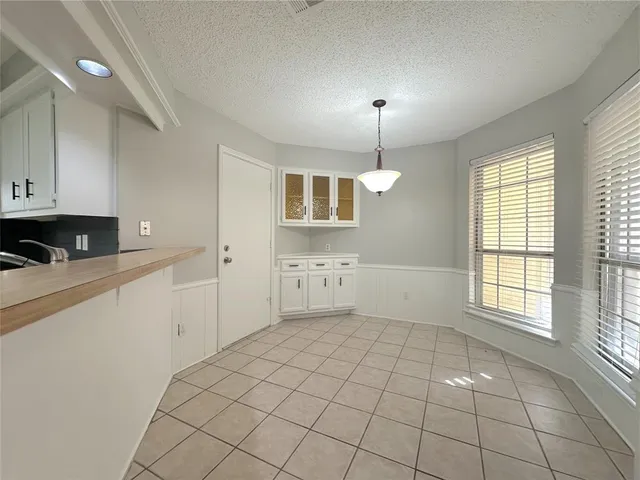 a kitchen with cabinets appliances and a sink