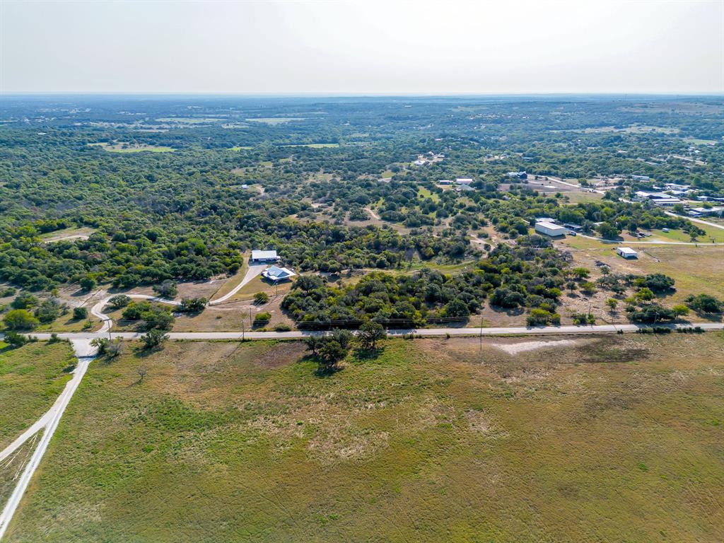 8310 Prather Road Springtown, TX 76082 - Photo 11 of 13 an aerial view of a houses with a yard and lake view