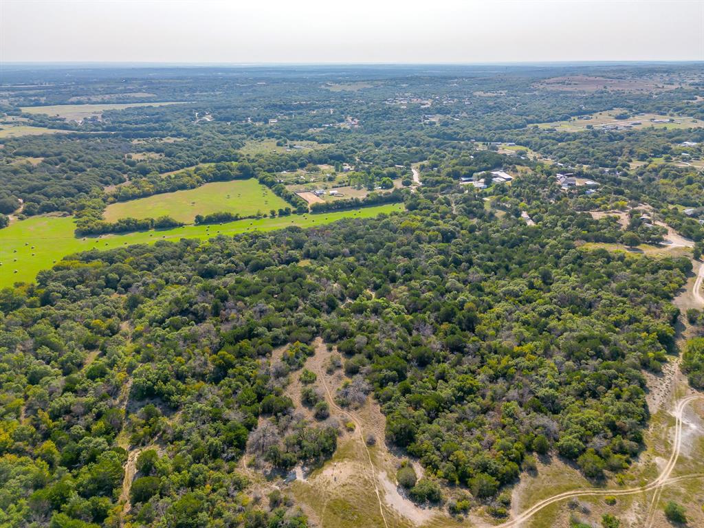 8310 Prather Road Springtown, TX 76082 - Photo 3 of 13 an aerial view of residential houses with outdoor space and swimming pool