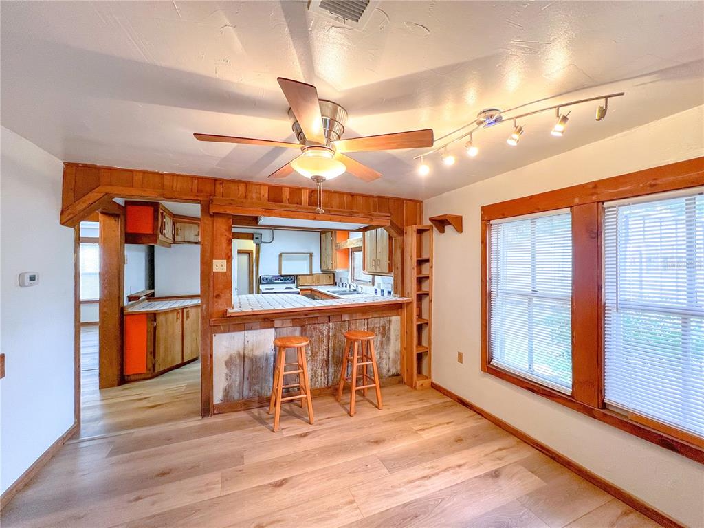25825 West Newberry Road Newberry, FL 32669 - Photo 7 of 16 a dining room with furniture and wooden floor