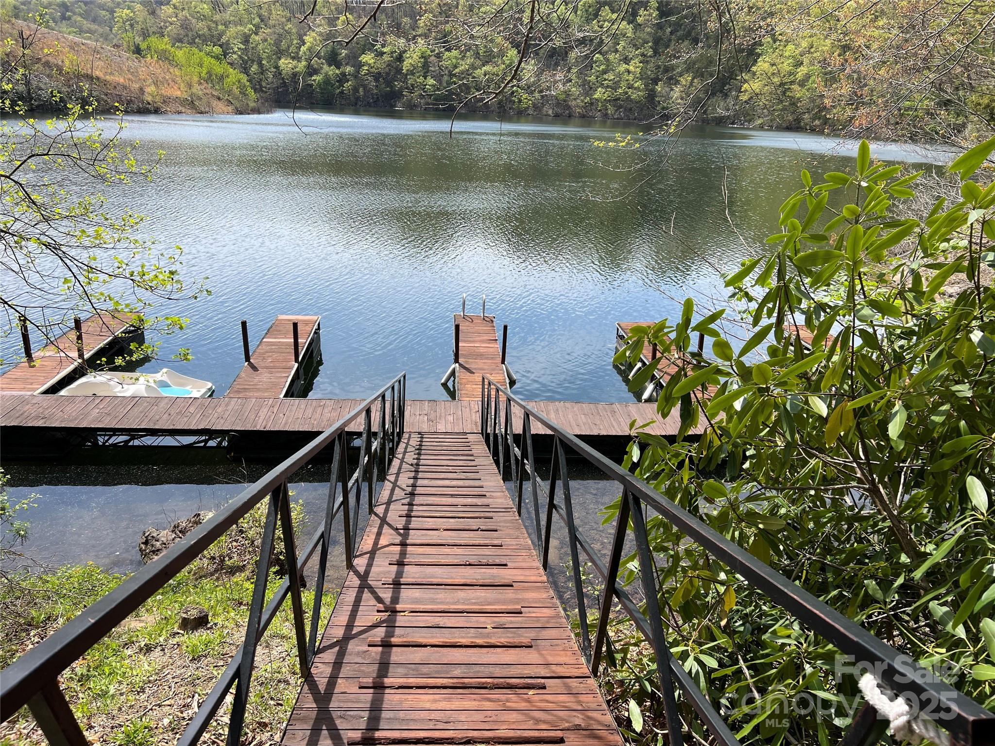 134 Dars Lane, Unit 7 Tuckasegee, NC 28783 - Photo 3 of 7 a view of a lake from a balcony