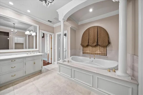 a spacious bathroom with a sink double vanity and a mirror