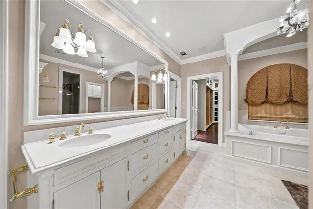 a bathroom with a granite countertop sink mirror and