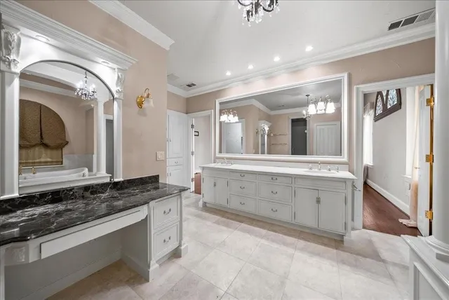 a spacious bathroom with a double vanity sink a mirror and a shower