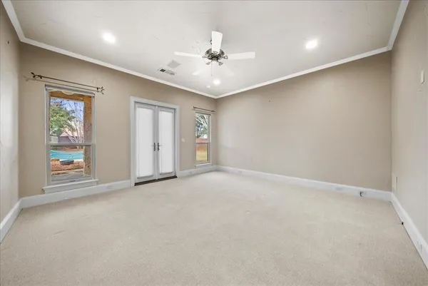 a bathroom with a granite countertop sink a toilet and a mirror