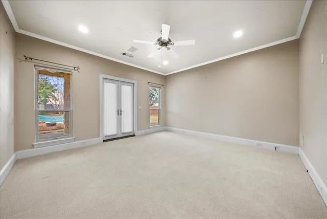 a bathroom with a granite countertop sink a toilet and a mirror