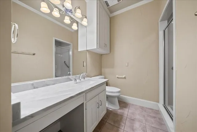 a kitchen with wooden cabinets and stainless steel appliances