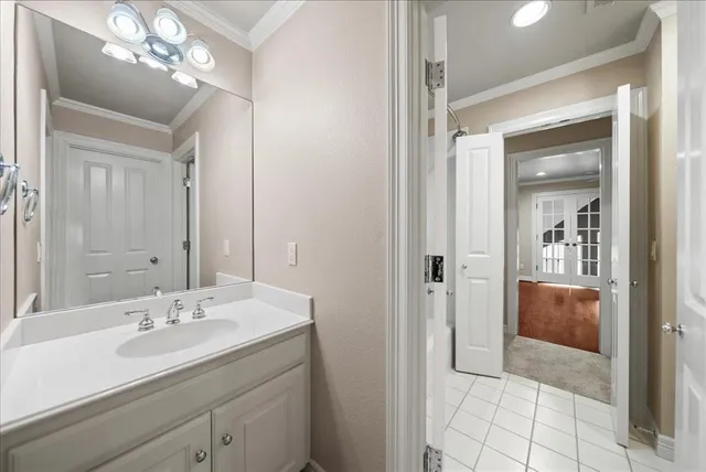 a view of an empty room with a ceiling fan