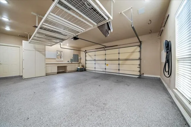 a front view of a house with yard and green space