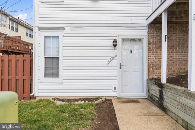 a view of a house with a door and a chair
