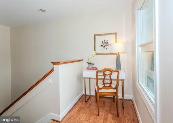 a view of workspace with furniture and window