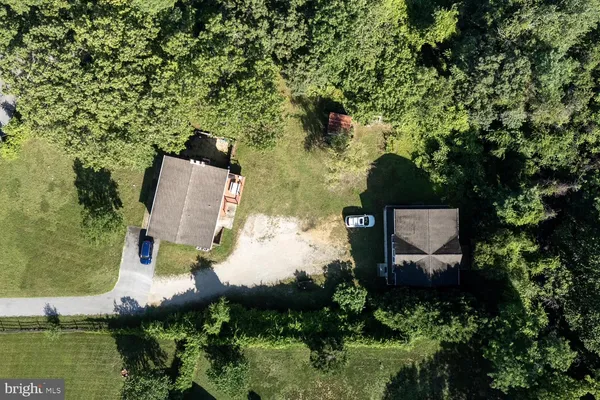 an aerial view of a house with outdoor space