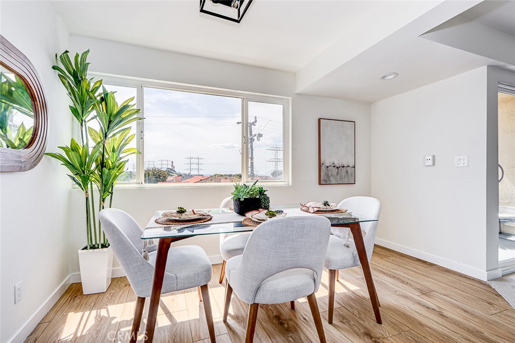 770 West Imperial Avenue, Unit 87 El Segundo, CA 90245 - Photo 11 of 29 a view of a dining room with furniture window and wooden floor