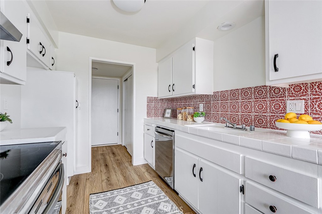 770 West Imperial Avenue, Unit 87 El Segundo, CA 90245 - Photo 7 of 29 a kitchen with a sink stove and cabinets