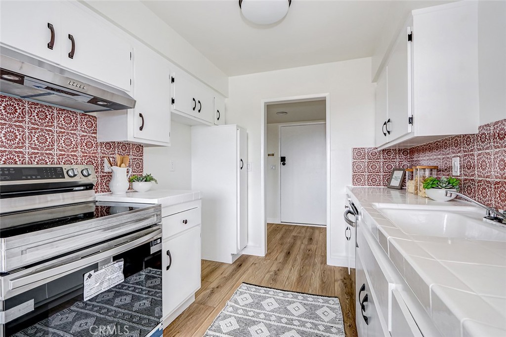 770 West Imperial Avenue, Unit 87 El Segundo, CA 90245 - Photo 9 of 29 a kitchen with a refrigerator and a sink