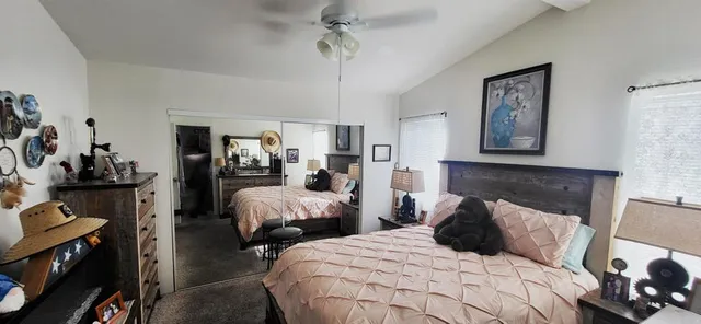 a bedroom with two beds and painted walls