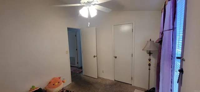 wooden floor in an empty room with a mirror