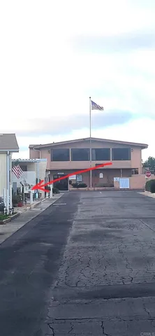 a view of a swimming pool with an outdoor seating