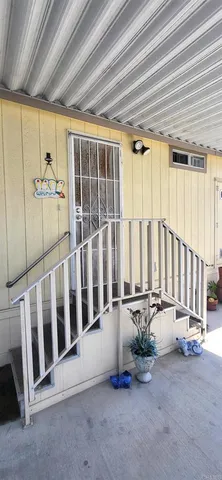 a view of a porch with wooden floor