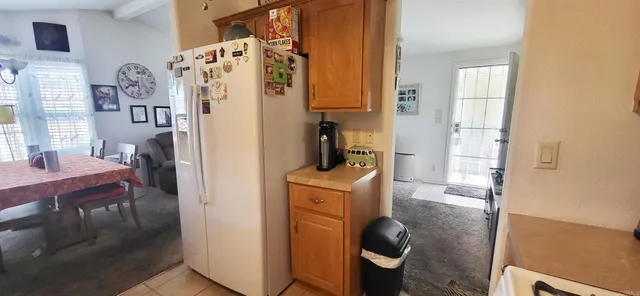 a room with a stove and a refrigerator