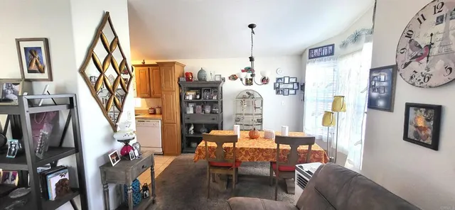 a living room with fireplace furniture and a window